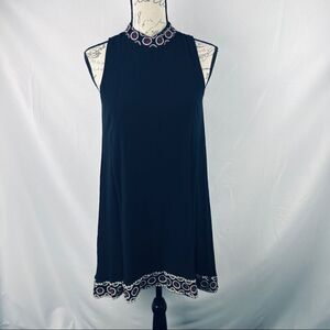 Black dress red detail at neckline sleeveless knee length size medium